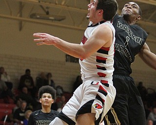 Canfield senior forward Jared Clark(13) goes for the layup as Harding senior Derek Culver(1) tries to swat the ball away during the fourth quarter as Warren G. Harding High School takes on Canfield High School at the Canfield High School Gymnasium in Canfield on Tuesday, Jan. 17, 2017. Harding won, 80-62...(Nikos Frazier | The Vindicator)..