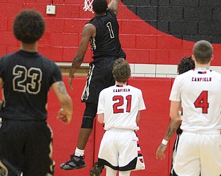 CHarding senior Derek Culver(1) dunks during the fourth quarter as Warren G. Harding High School takes on Canfield High School at the Canfield High School Gymnasium in Canfield on Tuesday, Jan. 17, 2017. Harding won, 80-62...(Nikos Frazier | The Vindicator)..