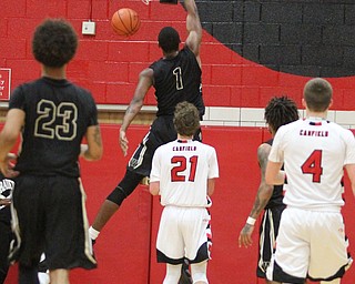 CHarding senior Derek Culver(1) dunks during the fourth quarter as Warren G. Harding High School takes on Canfield High School at the Canfield High School Gymnasium in Canfield on Tuesday, Jan. 17, 2017. Harding won, 80-62...(Nikos Frazier | The Vindicator)..