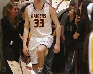 South Range senior Anthony Ritter breaks through a banner before the start of Tuesday nights matchup against McDonald at South Range High School.  Dustin Livesay  |  The Vindicator  1/17/17  South Range