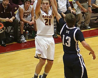 Brandon Youngs of South Range (21) goes up for a shot while being defended by McDonalds Dyland Portolese (13) during the second half of Tuesday nights matchup at South Range High School.  Dustin Livesay  |  The Vindicator  1/17/17  South Range