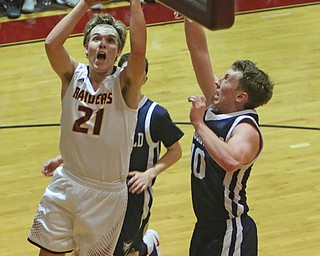 Brandon Youngs of South Range (21) goes up for a shot while being defended by McDonalds Evan McGoll (10) during the second half of Tuesday nights matchup at South Range High School.  Dustin Livesay  |  The Vindicator  1/17/17  South Range
