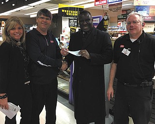 SPECIAL TO THE VINDICATOR
Churchill Commons Giant Eagle store in Liberty recently donated $2,553 to Salvation Army. The money was raised over the holiday season by Giant Eagle customers. Present for the donation, from left, are Pamela Graff, human resources director of Giant Eagle; Robert Graff, store owner; Major Elijah Kahn of Salvation Army; and Jeffery Saluga, store director.
