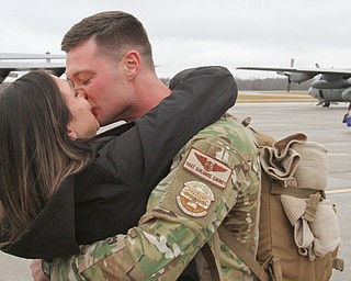 William D. Lewis The Vindicator USAF reserve Staff Sgt. Sheamus Carney of Cleveland gets a kiss from his girlfried Amber Dalton also of Cleveland after returning from deployment with members of US Air Force reserve unit at YARS  Jan. 18, 2017.