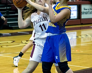 MICHAEL G TAYLOR | THE VINDICATOR- 01-18-17 -  Basketball -1st qtr, Boardman's #11 Alicia Saxton goes to the hoop against YVC #24 Klaudia Vaughn. Youngstown Valley Christian Eagles vs Boardman Spartans at Boardman High School in Boardman, OH