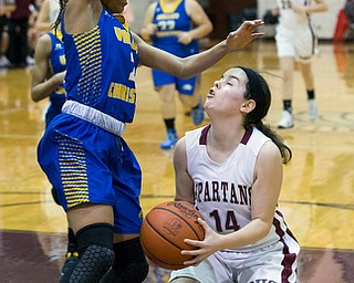 MICHAEL G TAYLOR | THE VINDICATOR- 01-18-17 -  Basketball -1st qtr, Boardman's #14 Lauren Pavlansky is stopped by the defense of YVC #2 India Snyder. Youngstown Valley Christian Eagles vs Boardman Spartans at Boardman High School in Boardman, OH.