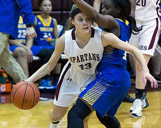 MICHAEL G TAYLOR | THE VINDICATOR- 01-18-17 -  Basketball -1st qtr, Boardman's #13 Cate Green drives to the basket against YVC #1 Asia Jones. Youngstown Valley Christian Eagles vs Boardman Spartans at Boardman High School in Boardman, OH.
