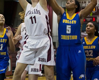 MICHAEL G TAYLOR | THE VINDICATOR- 01-18-17 -  Basketball -1st qtr, Boardman's #11 Alicia Saxton frabs the rebound away from YVC #5 Daisija Parks. Youngstown Valley Christian Eagles vs Boardman Spartans at Boardman High School in Boardman, OH.