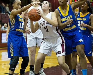 MICHAEL G TAYLOR | THE VINDICATOR- 01-18-17 -  Basketball -2nd qtr, Boardman's #11 Alicia Saxton drives against the defense of YVC #5 Daisija Parks (right) and #11 Imane Snydee. Youngstown Valley Christian Eagles vs Boardman Spartans at Boardman High School in Boardman, OH.