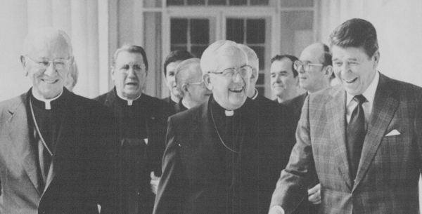 04181984 President Ronald Reagan walks with Bishop James Malone and other bishops in washington.