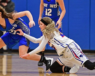 BERLIN CENTER, OHIO - JANUARY 19, 2017: Michaelina Terranova #22 of Jackson-Milton gains control of the ball while Gabby Baranowski #23 of Western Reserve dives on the floor in an attempt to force a turnover during the first half of their game Thursday night at Western Reserve High School. DAVID DERMER | THE VINDICATOR