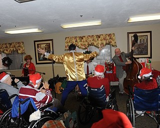 Neighbors | Alexis Bartolomucci.Beeghly Oaks residents and guests watched Elvis perform during the annual Holiday Celebration on Dec. 16.