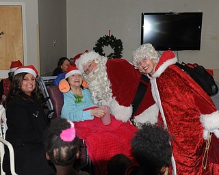 Neighbors | Submitted.Santa and Mrs. Claus visited resident Mary Wasko and her daughter Cathy Mondora at the Beeghly Oaks Holiday Celebration on Dec. 16.