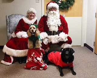 Neighbors | Submitted.Santa and Mrs. Claus visited guests at Beeghly Oaks with their therapy pets Milo and Mirelle during the annual Holiday Celebration on Dec. 16.
