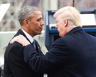 President Barack Obama speaks with President-elect Donald Trump during the presidential inauguration at the U.S. Capitol in Washington, Friday, Jan 20, 2017. (Saul Loeb/Pool Photo via AP)
