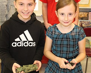 Neighbors | Submitted.Fourth-graders Andrew Murphy and Alexis Davis held some of the artifacts Professor Tom Delvaux brought in during his visit to Robinwood Lane.