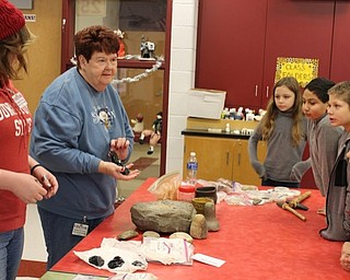 Neighbors | Submitted.Betsy Murphy showed the fourth-grade students of Robinwood Lane Elementary some of the artifacts from the prehistoric Indians of Ohio.