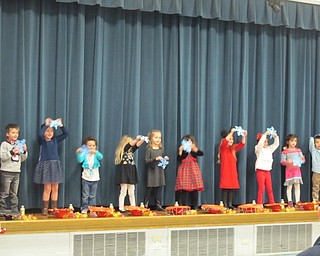 Neighbors | Alexis Bartolomucci.Students in Samantha Cox's class at North Preschool held up snowflakes during their Christmas sing performance on Dec. 22.
