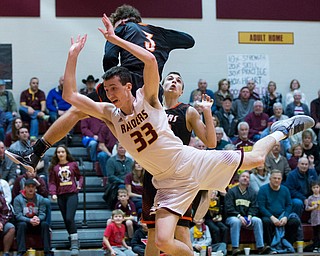 MICHAEL G TAYLOR | THE VINDICATOR- 01-20-17 - Basketball - 2nd qtr, South Range's #33 Anthony Ritter  shot attempt is stopped by Springfield's #3 Brandon Walters. Anthony was fouled on the play. New Middletown Springfield Tigers vs South Range Raiders at South Range High School in South Range, OH