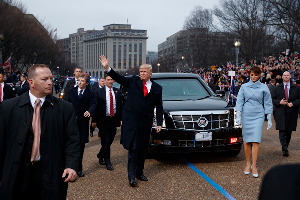 President Donald Trump and first lady Melania Trump walk near the White House in the inaugural parade after he was sworn in as the 45th President of the United States, Friday, Jan. 20, 2017, in Washington. (AP Photo/Evan Vucci, Pool)