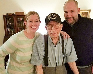 SPECIAL TO THE VINDICATOR: George Strom, center, celebrated his 100th birthday Jan. 18. On the left is his granddaughter, Jessica Jones of Orlando, Fla., and on the right is his grandson, Mathew Strom of Chicago.