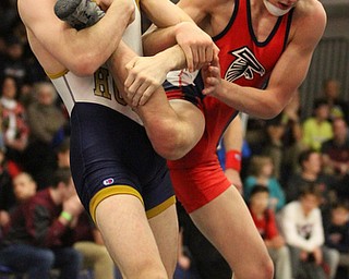 Lukus Stricker(white) of Archbishop Hoban holds onto Gus Sutton(red) of Fitch's leg at the Josh Hephner Memorial Wrestling Tournament at Austintown Fitch High School Gymnasium in Austintown on Saturday, Jan. 21, 2017. Stricker won by a pin...(Nikos Frazier | The Vindicator)..