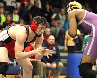 Michael Ferree(red) of Fitch and Braxton Freeman(purple) of Jackson face off at the Josh Hephner Memorial Wrestling Tournament at Austintown Fitch High School Gymnasium in Austintown on Saturday, Jan. 21, 2017. Feree won by points...(Nikos Frazier | The Vindicator)..
