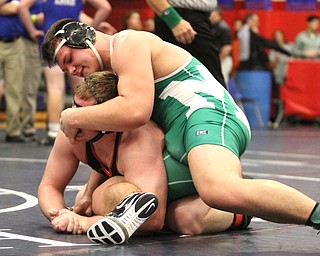 Paul Skye(green) of Mogadore looks down at Jack DelGarbino(Black) of Girard while he holds DelGarbino's mouth at the Josh Hephner Memorial Wrestling Tournament at Austintown Fitch High School Gymnasium in Austintown on Saturday, Jan. 21, 2017. DelGarbino won by points...(Nikos Frazier | The Vindicator)..