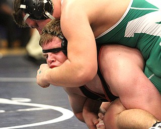 Jack DelGarbino(Black) of Girard's mouth is forced open by Paul Skye(green) of Mogadore's arm at the Josh Hephner Memorial Wrestling Tournament at Austintown Fitch High School Gymnasium in Austintown on Saturday, Jan. 21, 2017. DelGarbino won by points...(Nikos Frazier | The Vindicator)..