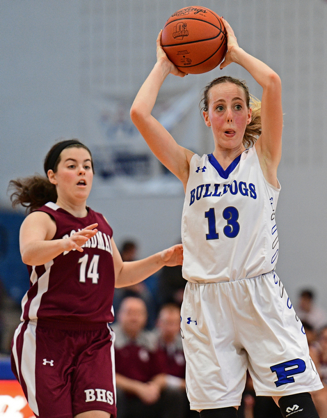 POLAND, OHIO - JANUARY 21, 2017: Maggie Sebest #13 of Poland passes the ball up court while being chased by Lauren Pavlansky #14 of Boardman during the second half of their game Saturday afternoon at Poland High School. DAVID DERMER | THE VINDICATOR