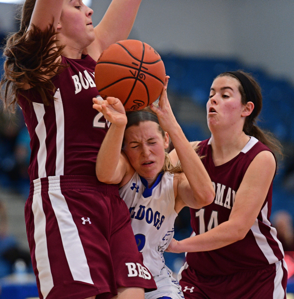 POLAND, OHIO - JANUARY 21, 2017: Juliana Blangero #32 of Poland has the ball knocked out of her control while colliding with Lauren Gabriele #20 and Lauren Pavlansky #14 of Boardman under the basket during the second half of their game Saturday afternoon at Poland High School. DAVID DERMER | THE VINDICATOR