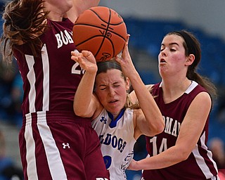 POLAND, OHIO - JANUARY 21, 2017: Juliana Blangero #32 of Poland has the ball knocked out of her control while colliding with Lauren Gabriele #20 and Lauren Pavlansky #14 of Boardman under the basket during the second half of their game Saturday afternoon at Poland High School. DAVID DERMER | THE VINDICATOR