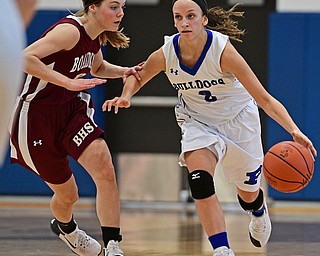 POLAND, OHIO - JANUARY 21, 2017: Sarah Bury #2 of Poland drives on Cate Green #13 of Boardman during the second half of their game Saturday afternoon at Poland High School. DAVID DERMER | THE VINDICATOR
