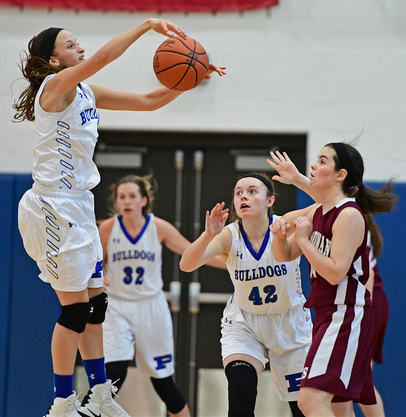 POLAND, OHIO - JANUARY 21, 2017: Sarah Bury #2 of Poland jumps to block the pass from Lauren Pavlansky #14 of Boardman during the second half of their game Saturday afternoon at Poland High School. DAVID DERMER | THE VINDICATOR