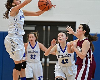 POLAND, OHIO - JANUARY 21, 2017: Sarah Bury #2 of Poland jumps to block the pass from Lauren Pavlansky #14 of Boardman during the second half of their game Saturday afternoon at Poland High School. DAVID DERMER | THE VINDICATOR