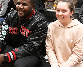 William D. Lewis The Vindicator Former OSU standout Cardale Jones poses  shot with Olivia Booth 12, of McDonald.  Her sister,Anna Booth(8th grade) ,was recently was diagnosed with cancer. Jones visited Mondays McDonald at Mineral Ridge game to show support for Anna who didn't attend the game. Jones visited her at her McDonald home before the game.