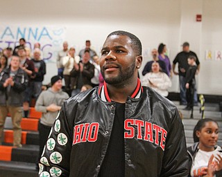 William D. Lewis The Vindicator Former OSU standout Cardale Jones waves to the crowd during a basketbnall game at Mineral Ridge Jan 23, 2017. basketball team. One of the members of McDonald Jr HS girls basketball team Anna Booth(8th grade) was recently was diagnosed with cancer. Jones visited Mondays McDonald at Mineral Ridge game to show support for Anna who didn't attend the game. Jones visited her at her McDonald home before the game.