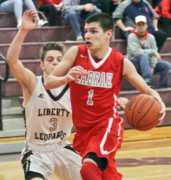 William D. Lewis The Vindicator  LaBrae's Mike Eakins (1) drives around Liberty's Kevin Hawn(3) during Jan 24, 2017 action at Liberty.