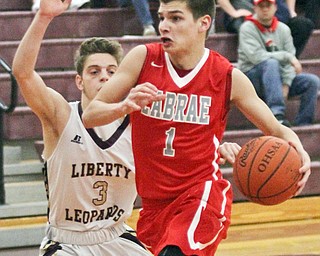 William D. Lewis The Vindicator  LaBrae's Mike Eakins (1) drives around Liberty's Kevin Hawn(3) during Jan 24, 2017 action at Liberty.