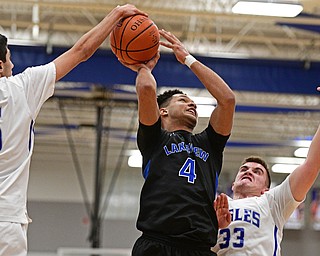 HUBBARD, OHIO - JANUARY 24, 2016: Jatise Garrison #4 of Lakeview has his shot blocked by Bashar Rasoul #5 of Hubbard during the first half of their game Tuesday night at Hubbard High School. DAVID DERMER | THE VINDICATOR..Kent Kroynovich #33 of Hubbard pictured.