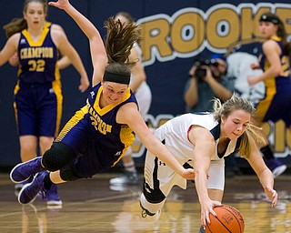 MICHAEL G TAYLOR | THE VINDICATOR- 01-25-17 - Basketball - 3rd qtr., Champion's #20 Molly Williams dives attempting to steal the ball from Brookfield's #2 McKenzie Drapola. Champion Lady Flashes vs Brookfield Lady Warriors at Brookfield High School in Brookfield, OH
