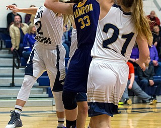 MICHAEL G TAYLOR | THE VINDICATOR- 01-25-17 - Basketball - 3rd qtr., Champion's #33 Megan Turner has her shot blocked by Brookfield's #2 McKenzie Drapola. Brookfield's #21 Lauren Pesa is also defending.  Champion Lady Flashes vs Brookfield Lady Warriors at Brookfield High School in Brookfield, OH