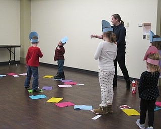 Neighbors | Alexis Bartolomucci.Children who attended the Candy Carnival event at the Boardman library on Dec. 28 stood on the squares as they played a game of life-size Candy Land.