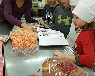 Neighbors | Submitted.Boardman Food Service Director Natalie Winkle is pictured instructing Tot Chefs.