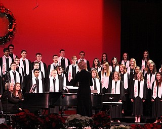 Neighbors | Abby Slanker.Under the direction of Canfield High School Choir Director Kelly Scurich, the concert choir performed holiday songs for family and friends at the Choral Music Department’s annual Winter Concert on Dec. 8.