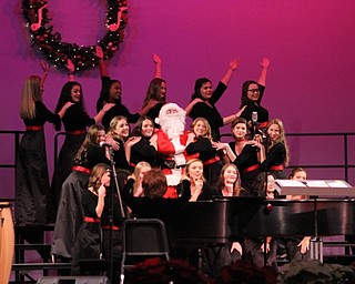 Neighbors | Abby Slanker.The Canfield High School One Octave Higher choir ended their performance of “Boogie Woogie Santa Claus” with a surprise appearance by Santa Claus at the Choral Music Department’s annual Winter Concert on Dec. 8.