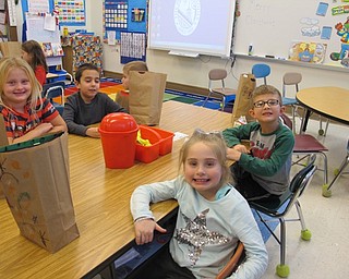 Neighbors | Alexis Bartolomucci.Kindergarten students at Poland Union celebrated the last day of class before winter break by decorating a goodie bag to bring their Christmas treats home in on Dec. 22.