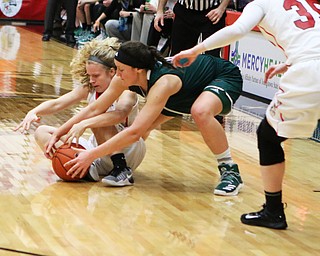 Youngstown State's Melinda Trimmer (14) fights for a loose ball with Green Bay's Caitlyn Hibner (4) during the second half of Thursday nights matchup at the Beeghly Center.   Dustin Livesay  |  The Vindicator  1/26/17  YSU
