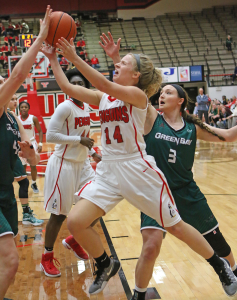 Youngstown State's Melinda Trimmer (14) goes in for a layup while being defended by Green Bay's Mackenzie Wolf (42)  during the second half of Thursday nights matchup at the Beeghly Center.   Dustin Livesay  |  The Vindicator  1/26/17  YSU