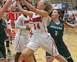 Youngstown State's Melinda Trimmer (14) goes in for a layup while being defended by Green Bay's Mackenzie Wolf (42)  during the second half of Thursday nights matchup at the Beeghly Center.   Dustin Livesay  |  The Vindicator  1/26/17  YSU
